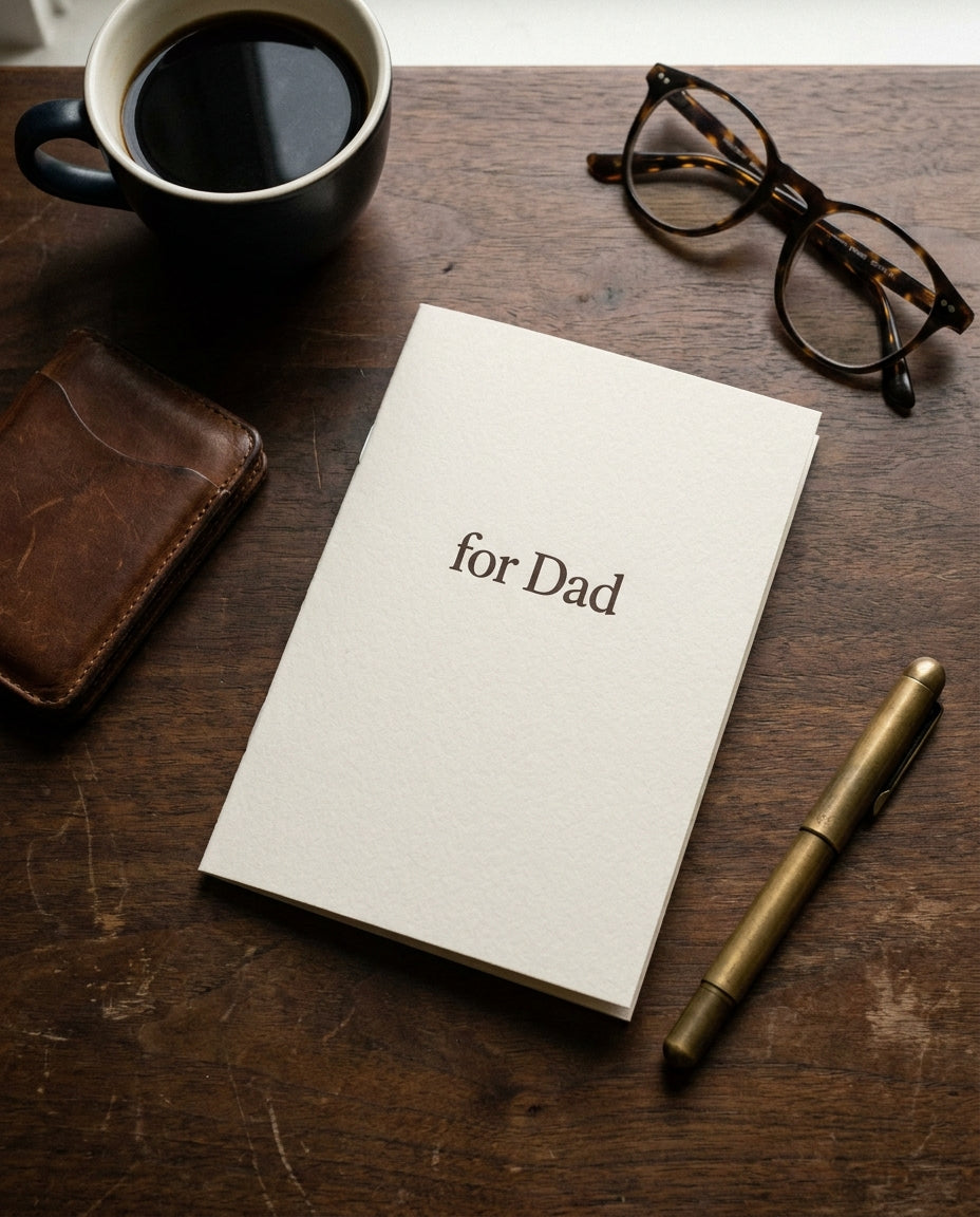 Dad Coupon Book flat lay with coffee and pen